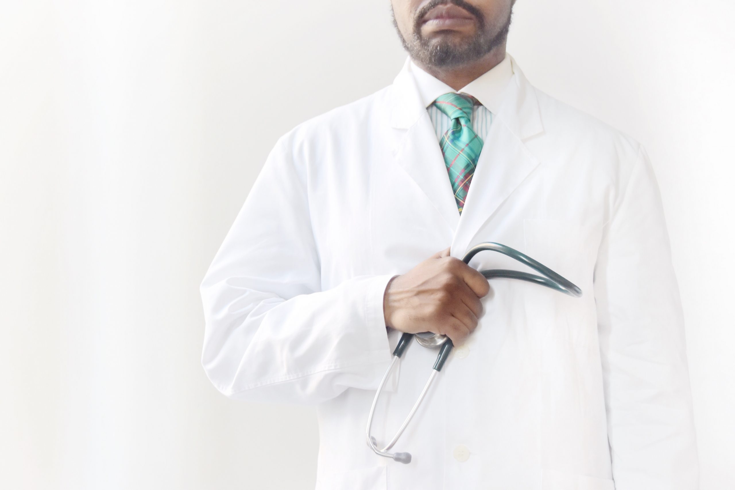 Medical professional standing with stethoscope