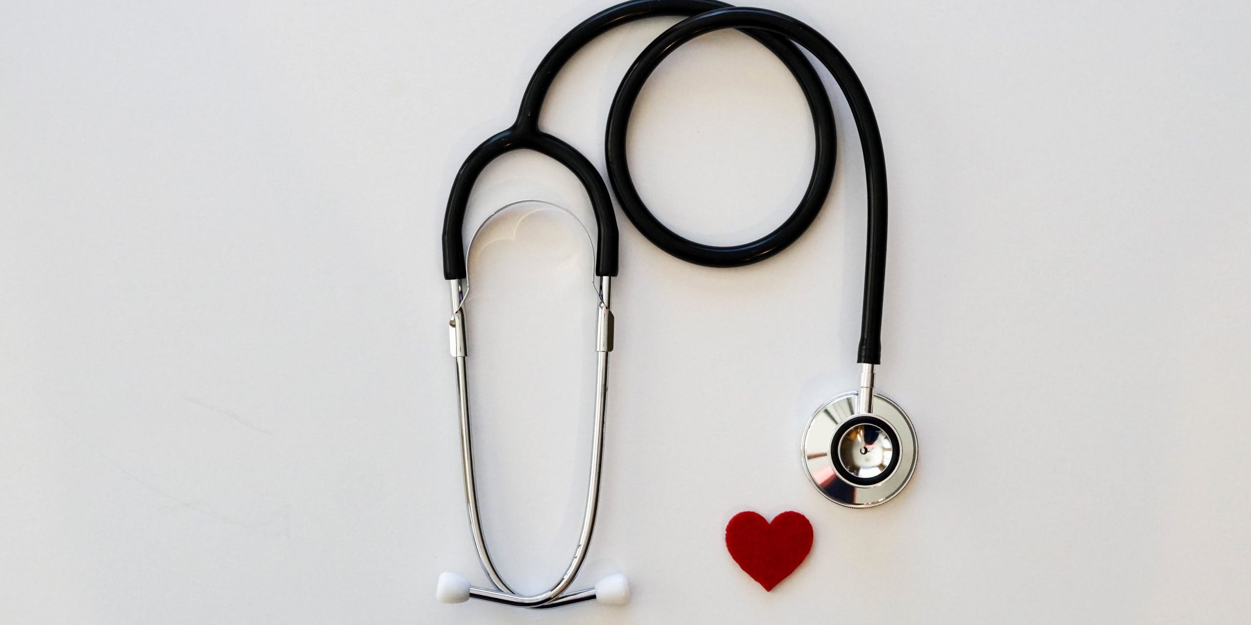 Overhead view of a stethoscope and a heart