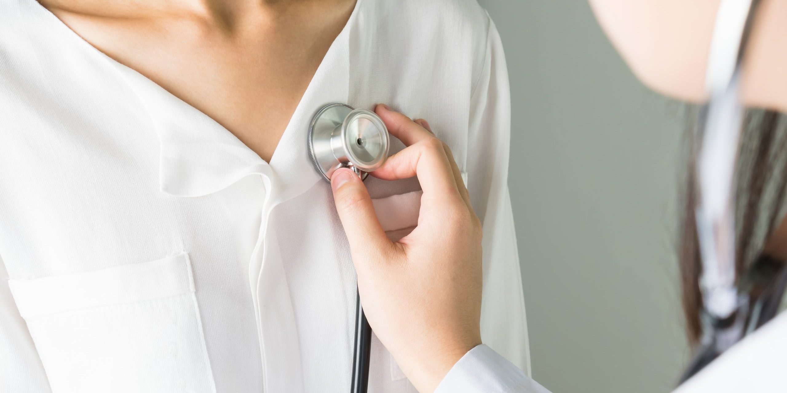 Doctor is using a stethoscope for patient examination